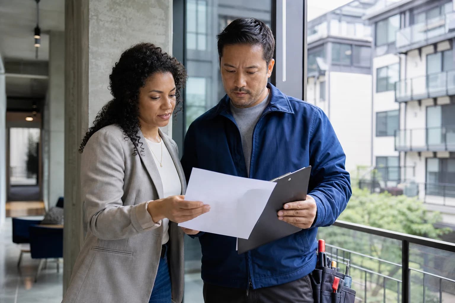 A property manager and facilities professional reviewing building operations